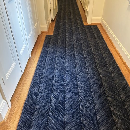 Blue patterned carpet and runner installation
